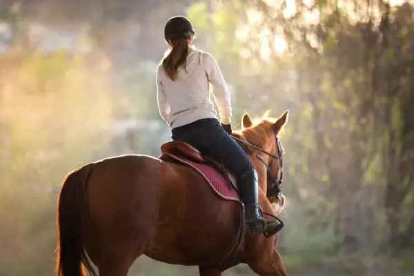 women riding horse